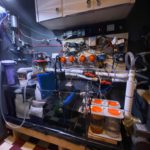 Complex aquarium filtration system with various equipment.